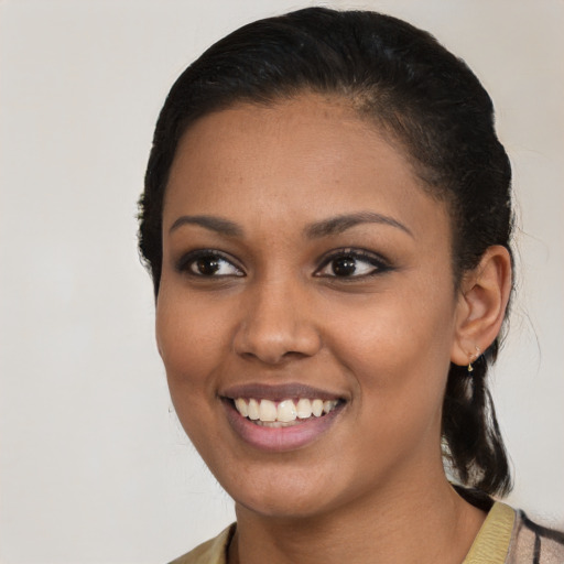 Joyful latino young-adult female with medium  black hair and brown eyes