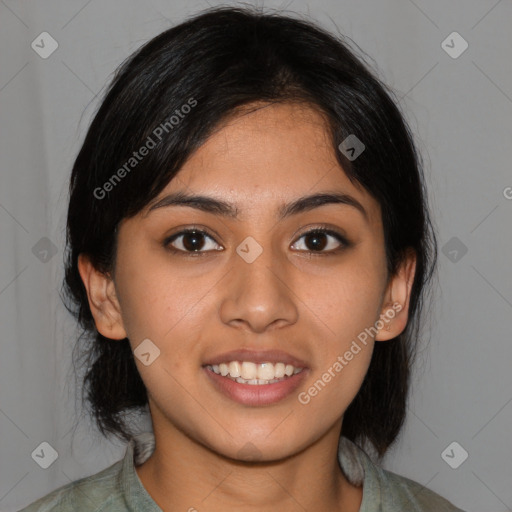 Joyful latino young-adult female with medium  black hair and brown eyes