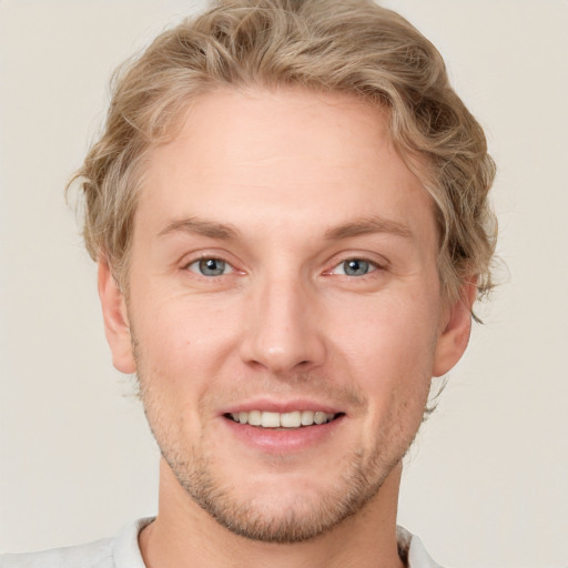 Joyful white adult male with short  brown hair and grey eyes