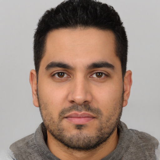 Neutral latino young-adult male with short  black hair and brown eyes