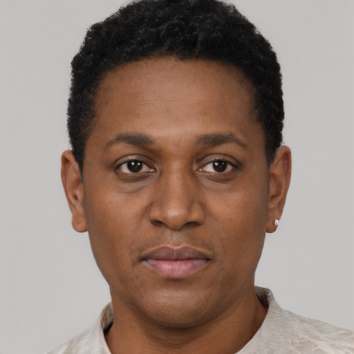 Neutral black young-adult male with short  black hair and brown eyes