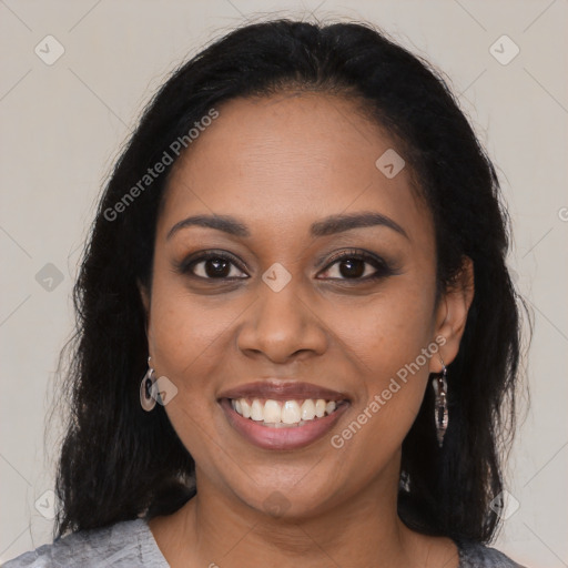 Joyful black young-adult female with medium  brown hair and brown eyes