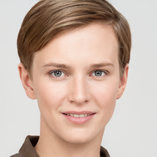 Joyful white young-adult female with short  brown hair and grey eyes