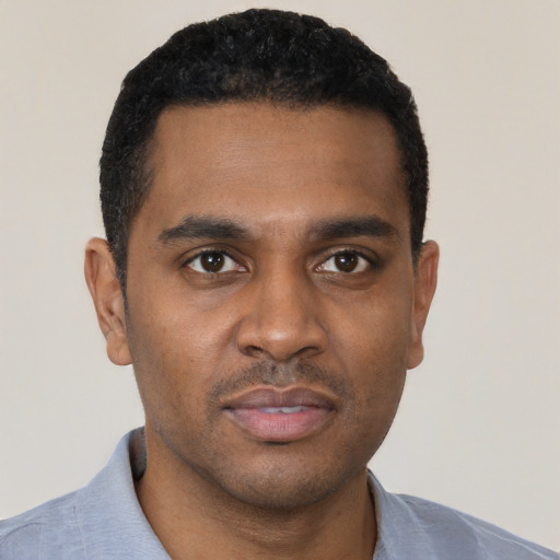 Neutral black young-adult male with short  black hair and brown eyes