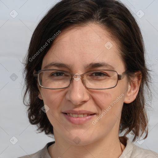 Joyful white adult female with medium  brown hair and brown eyes