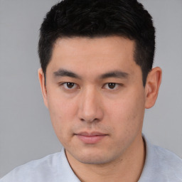 Neutral white young-adult male with short  black hair and brown eyes