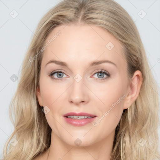 Joyful white young-adult female with long  brown hair and blue eyes