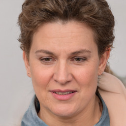 Joyful white adult female with short  brown hair and brown eyes