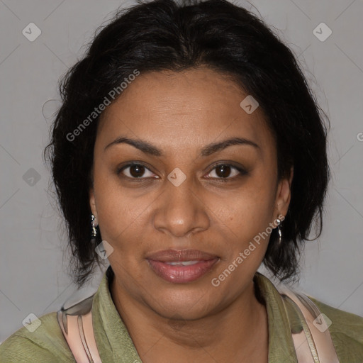 Joyful black adult female with medium  brown hair and brown eyes