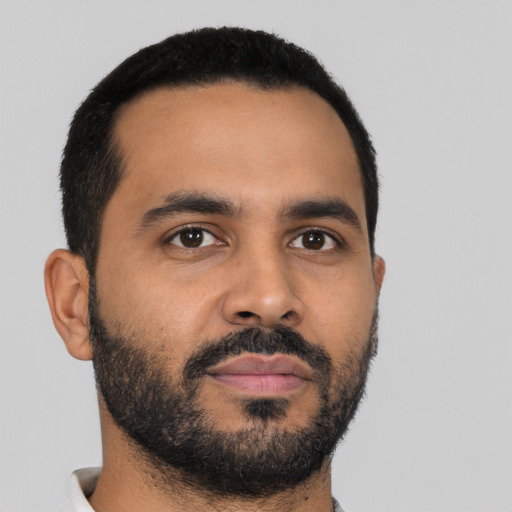Neutral latino young-adult male with short  black hair and brown eyes