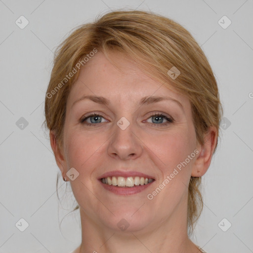 Joyful white young-adult female with medium  brown hair and blue eyes