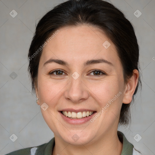 Joyful white adult female with medium  brown hair and brown eyes