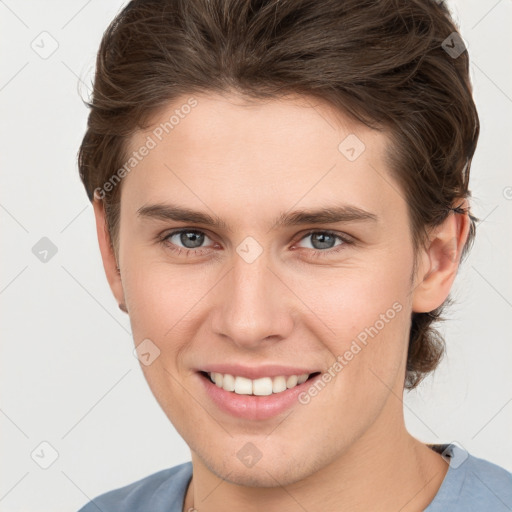 Joyful white young-adult female with short  brown hair and grey eyes