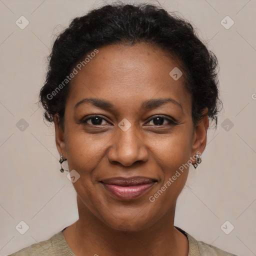 Joyful black adult female with short  brown hair and brown eyes