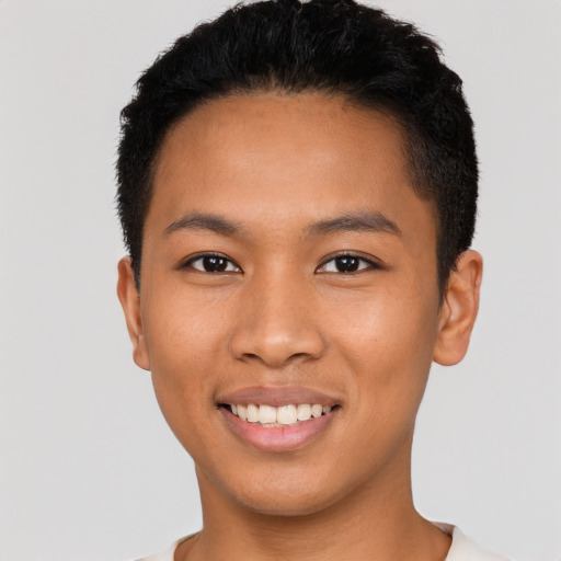 Joyful latino young-adult male with short  brown hair and brown eyes