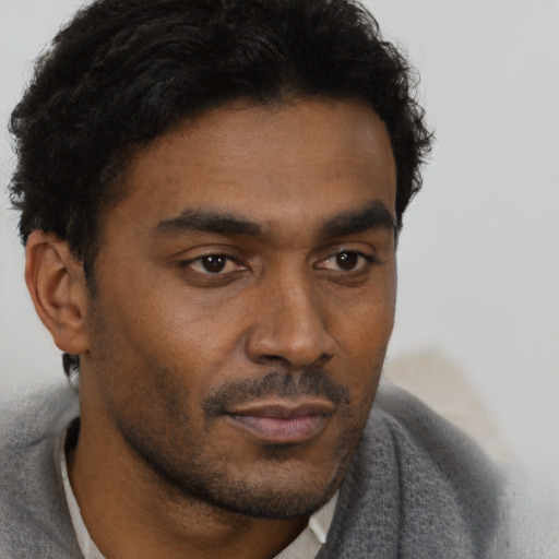 Neutral black young-adult male with short  brown hair and brown eyes
