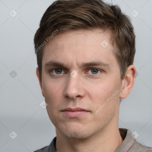 Neutral white young-adult male with short  brown hair and grey eyes