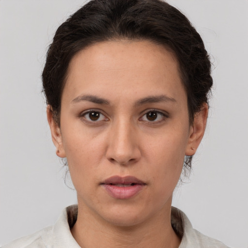 Neutral white young-adult female with short  brown hair and brown eyes