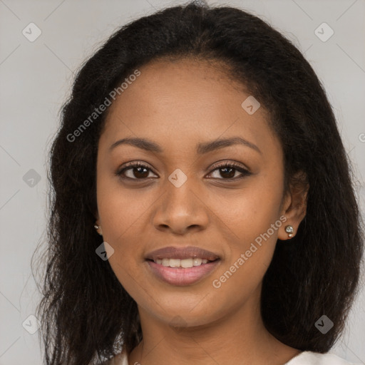 Joyful black young-adult female with long  brown hair and brown eyes