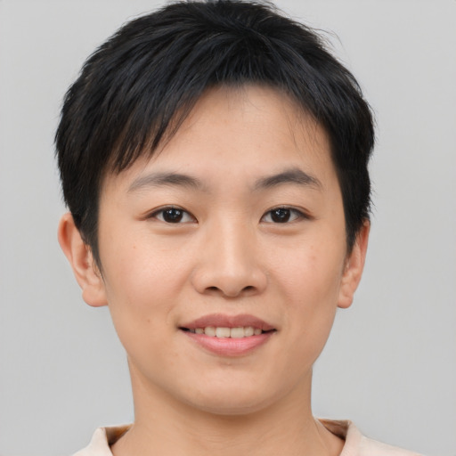 Joyful asian young-adult male with short  brown hair and brown eyes