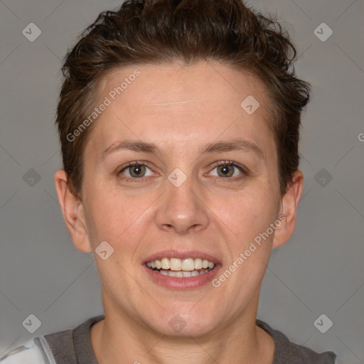 Joyful white adult female with short  brown hair and grey eyes