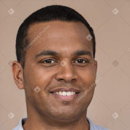 Joyful latino young-adult male with short  brown hair and brown eyes