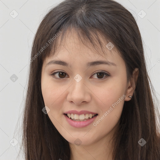 Joyful asian young-adult female with long  brown hair and brown eyes