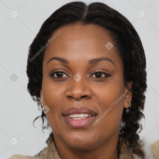 Joyful black adult female with medium  brown hair and brown eyes