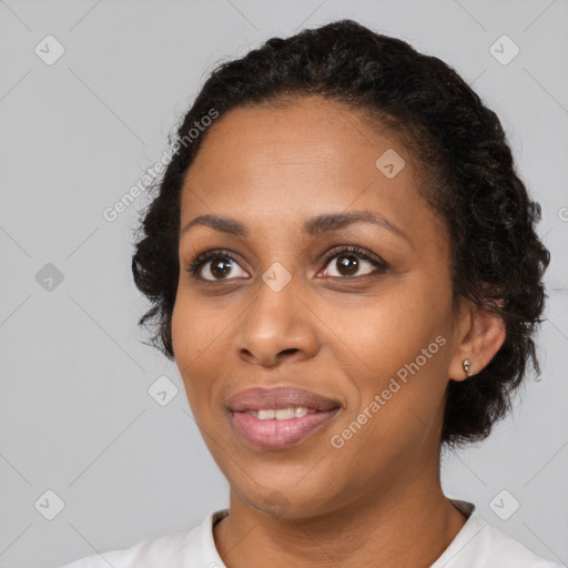 Joyful black young-adult female with medium  black hair and brown eyes