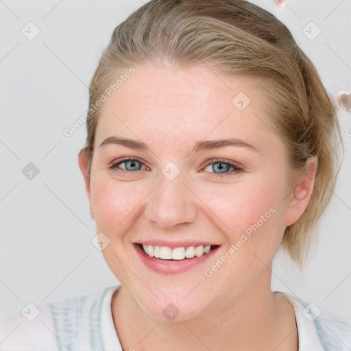 Joyful white young-adult female with medium  brown hair and blue eyes