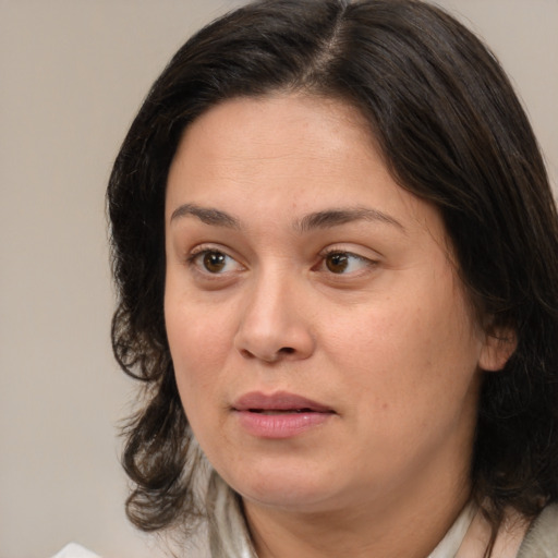 Joyful white adult female with medium  brown hair and brown eyes