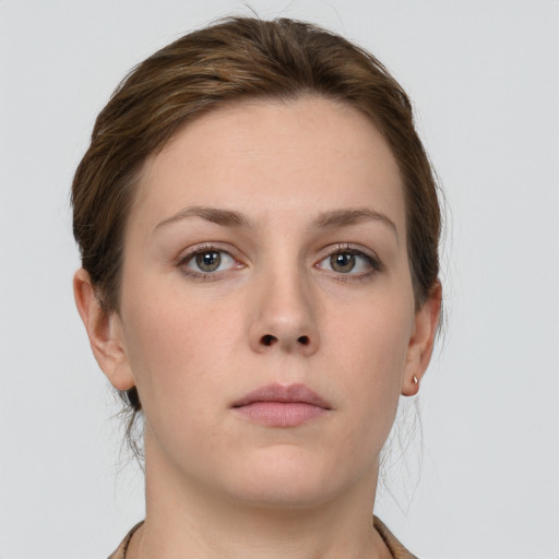 Neutral white young-adult female with short  brown hair and grey eyes