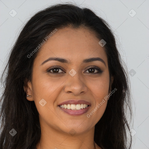 Joyful latino young-adult female with long  brown hair and brown eyes