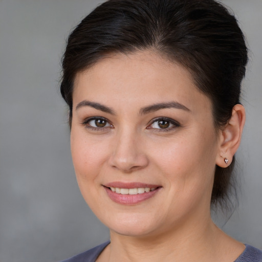 Joyful white young-adult female with medium  brown hair and brown eyes