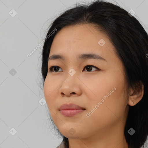 Joyful asian young-adult female with medium  black hair and brown eyes