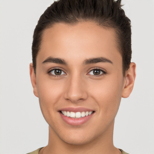 Joyful white young-adult female with short  brown hair and brown eyes