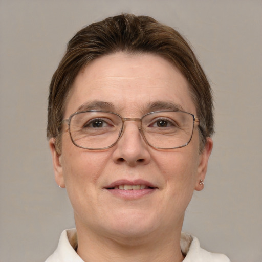 Joyful white adult female with short  brown hair and grey eyes