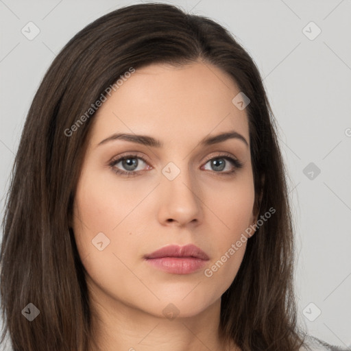 Neutral white young-adult female with long  brown hair and brown eyes