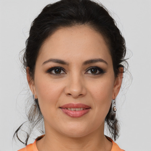 Joyful latino young-adult female with medium  brown hair and brown eyes