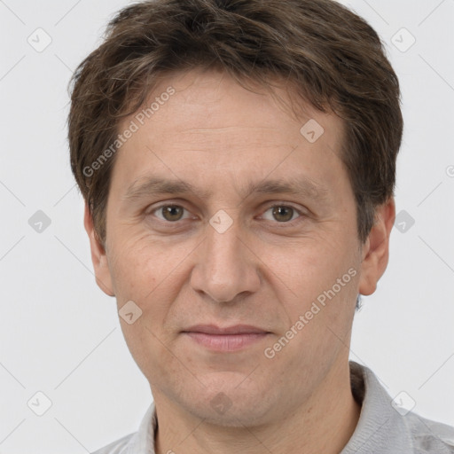 Joyful white adult male with short  brown hair and grey eyes