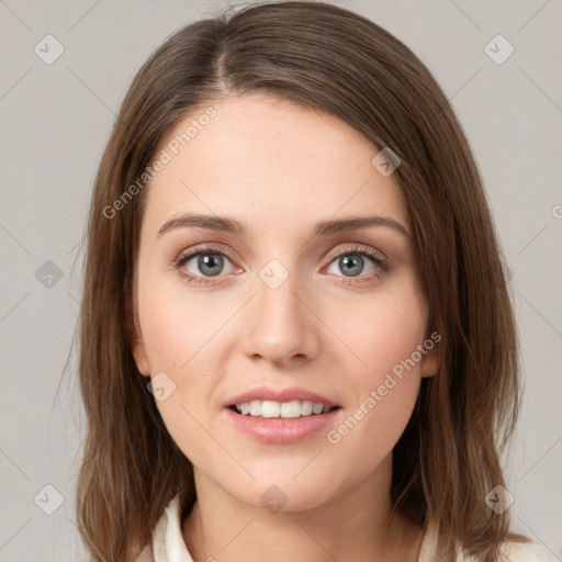 Joyful white young-adult female with medium  brown hair and green eyes