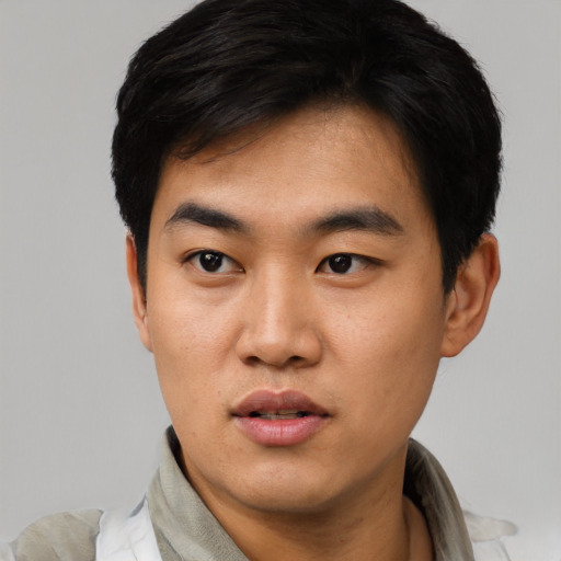 Neutral asian young-adult male with short  black hair and brown eyes