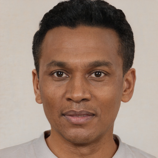 Neutral black young-adult male with short  black hair and brown eyes