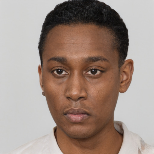 Neutral black young-adult male with short  black hair and brown eyes