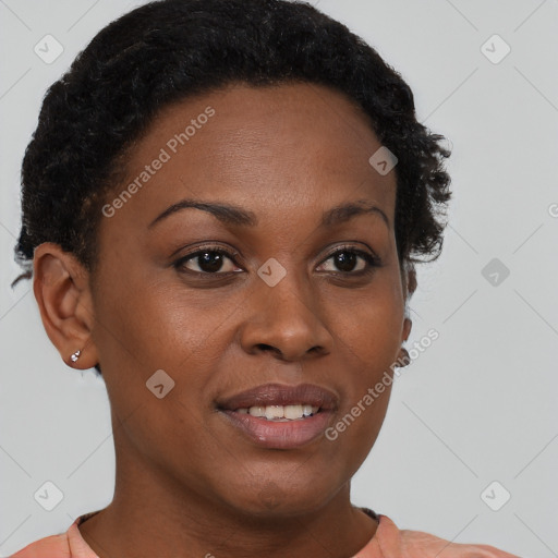 Joyful black young-adult female with short  brown hair and brown eyes