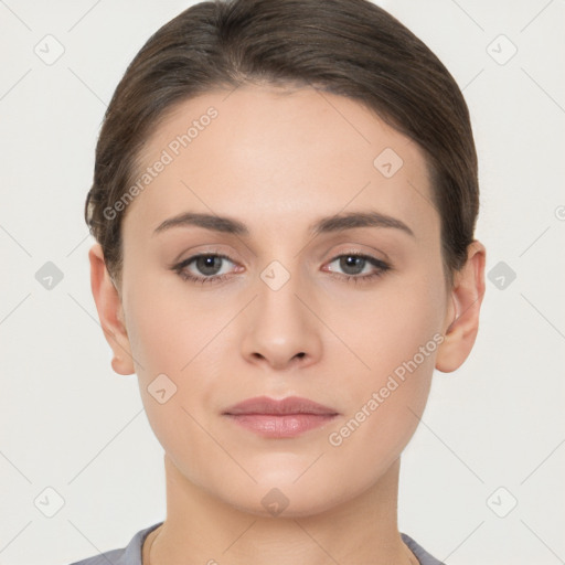 Neutral white young-adult female with short  brown hair and brown eyes