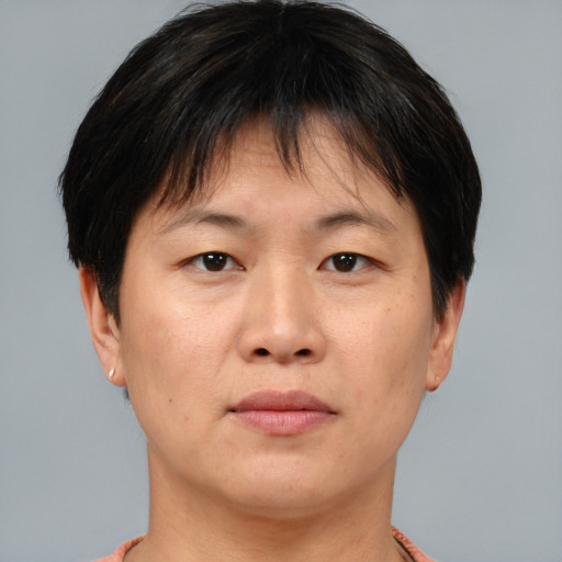 Neutral asian young-adult female with short  brown hair and brown eyes