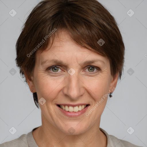 Joyful white adult female with medium  brown hair and grey eyes