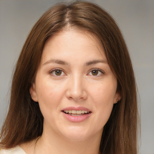 Joyful white young-adult female with medium  brown hair and brown eyes