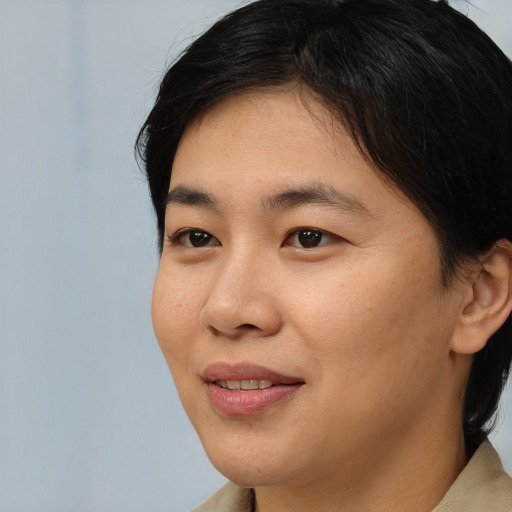 Joyful white young-adult female with medium  black hair and brown eyes